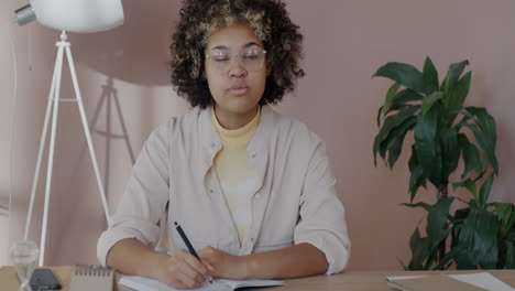 young woman taking notes