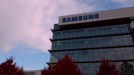 samsung research america sra campus in silicon valley bottom up view with red fall trees landscape under overcast sky