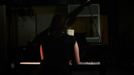 woman playing a piano