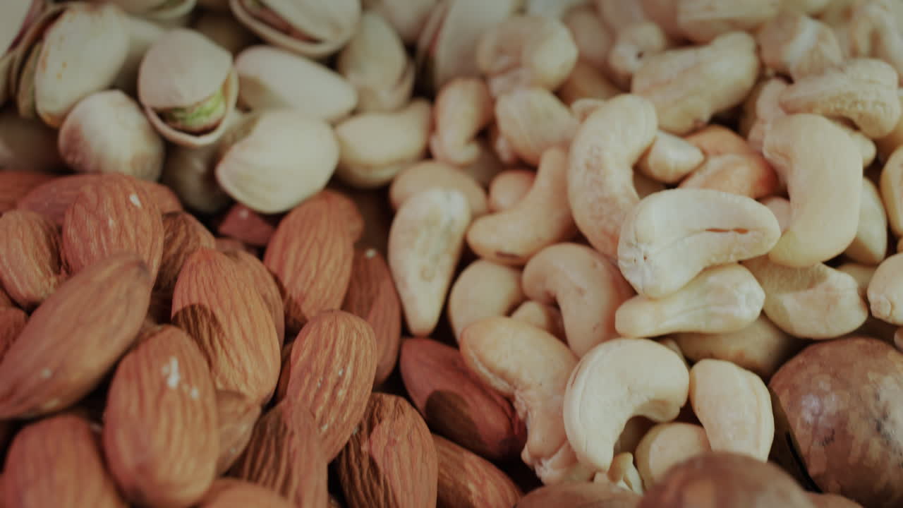 Handfuls of ready-to-eat nuts of different varieties 2