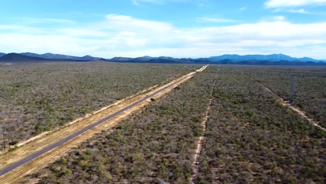 Aerial-view-over-the-vast-fields-of-Baja-Road-and-the-transpeninsular-highway-in-Baja-California-Sur,-Mexico