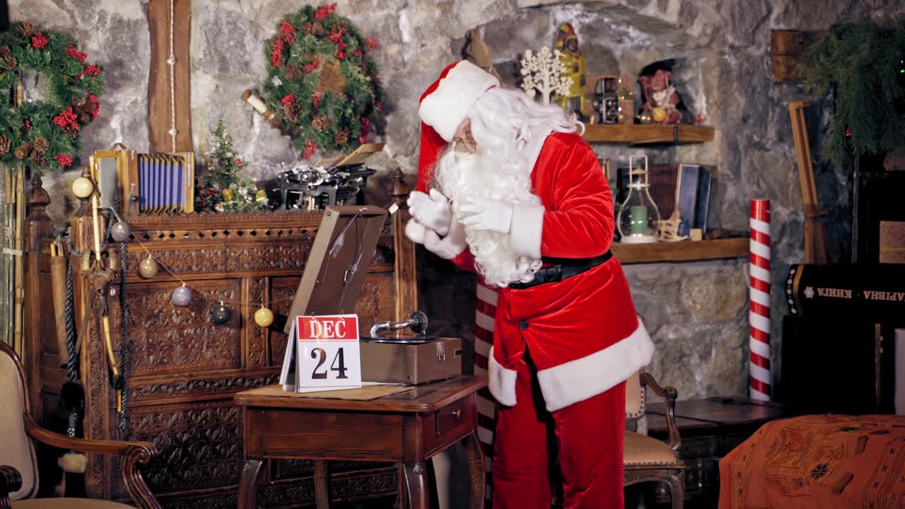 Santa Claus waiting for Christmas. Santa Claus at home preparing for Christmas