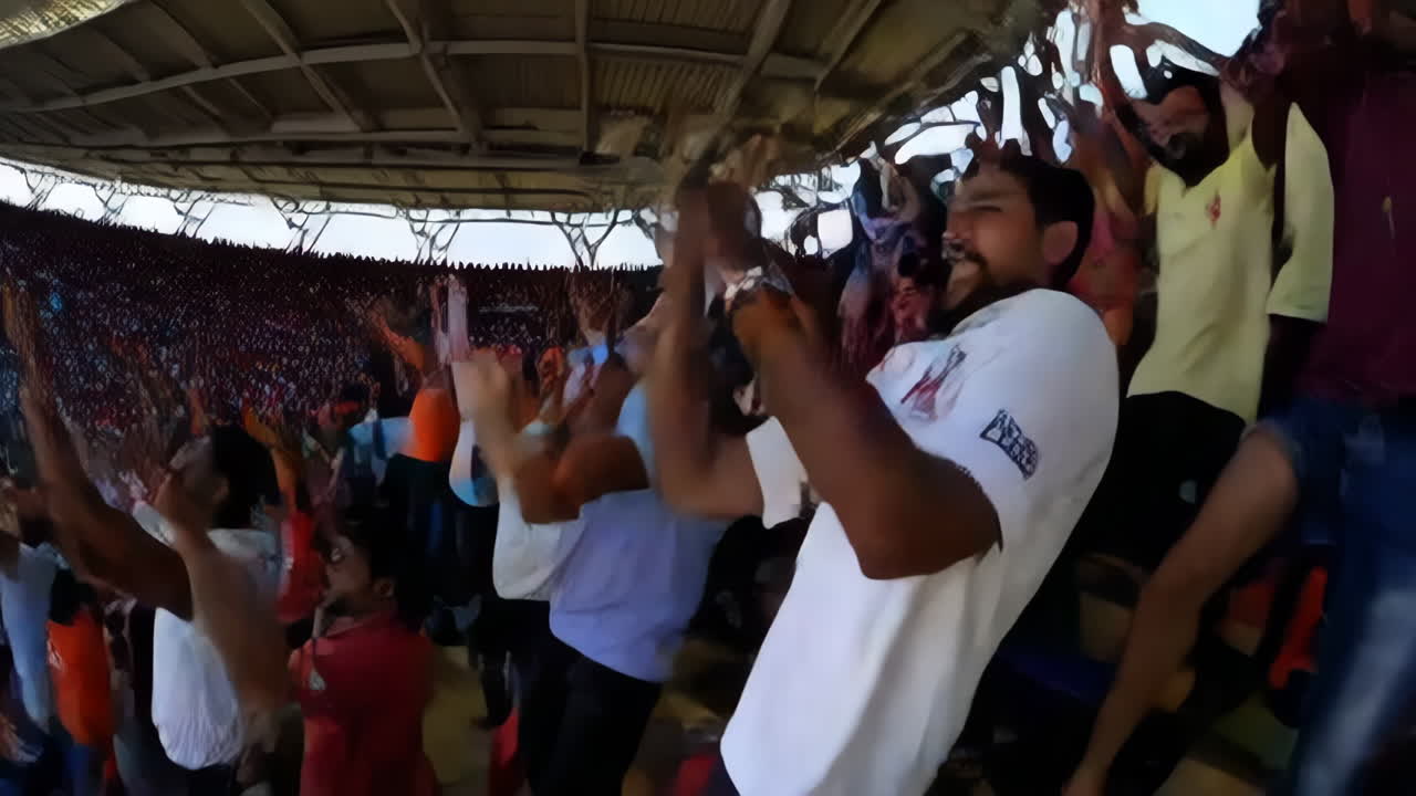 Cricket Match in a Stadium with Excited Fans