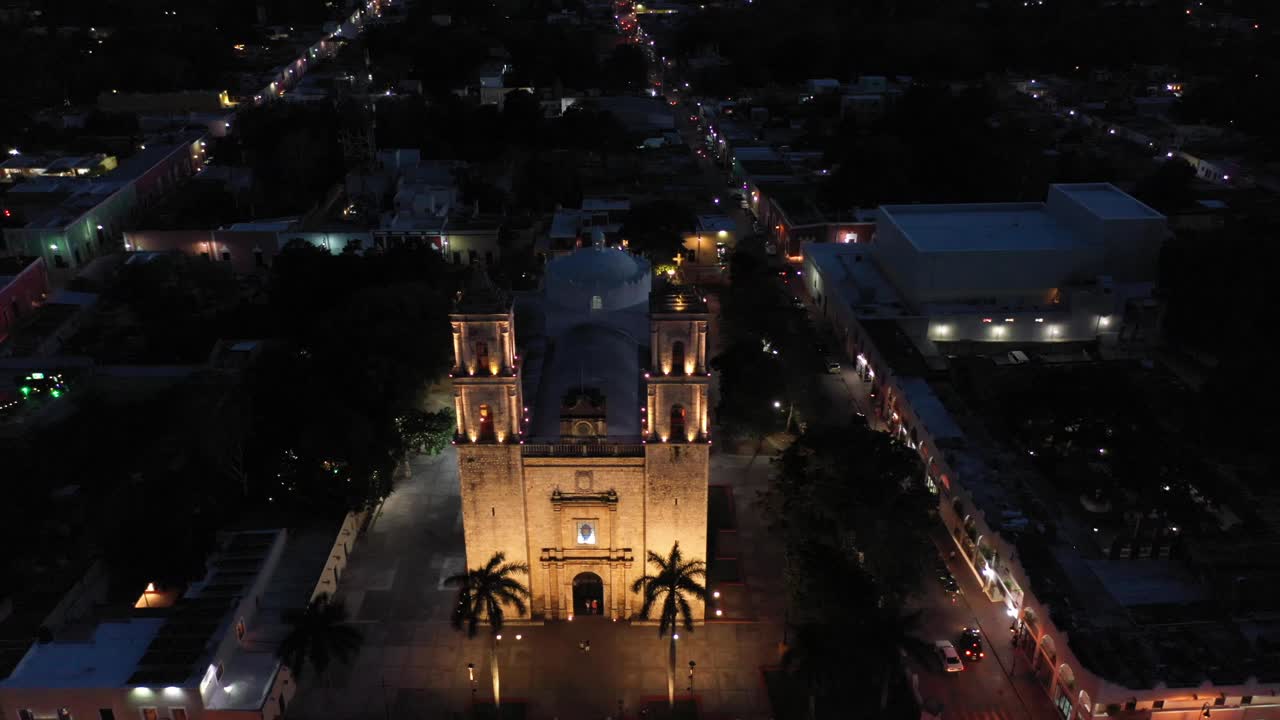 High night time aerial descent in front of Catedral de San Gervasio in Valladolid, Yucatan, Mexico