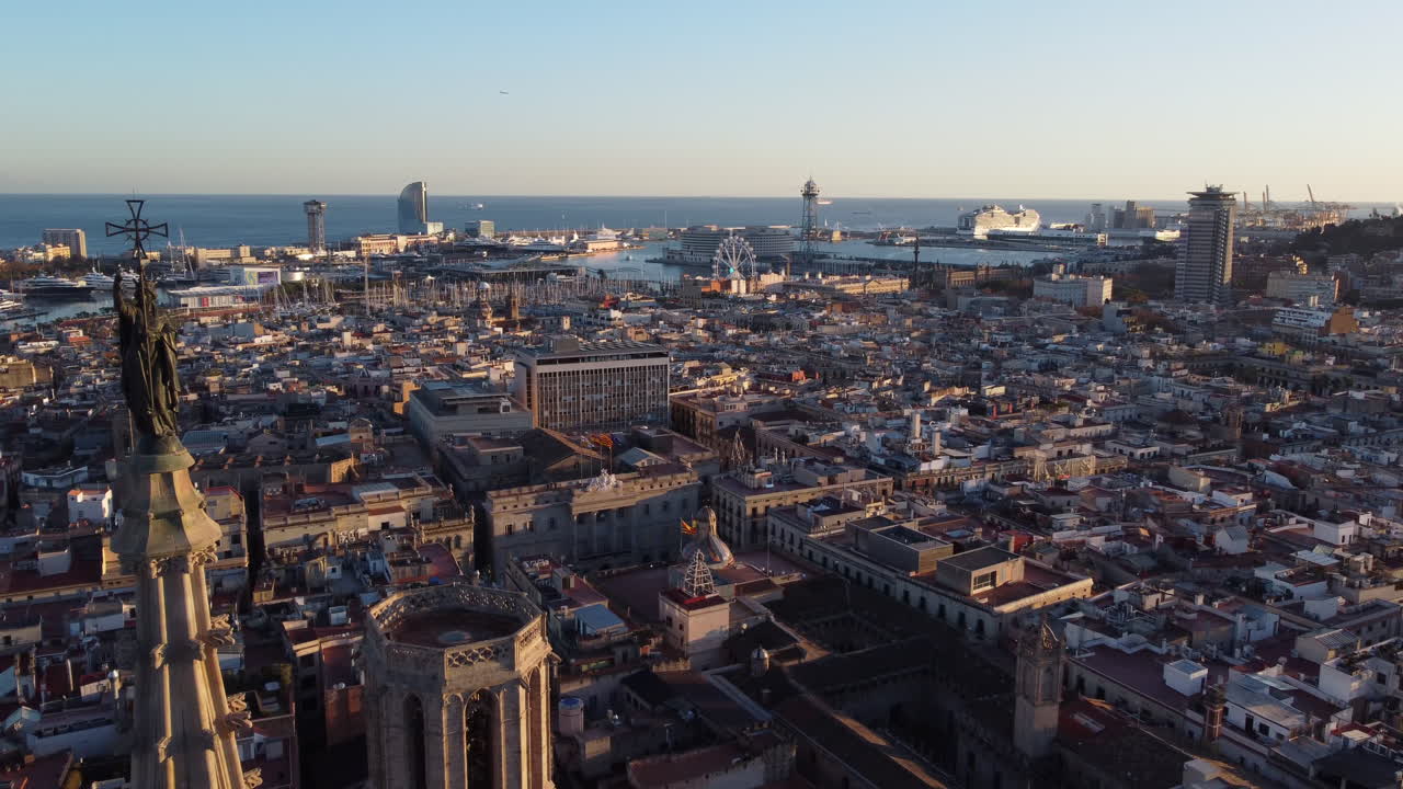 Aerial dolly out revealing cathedral of Barcelona in middle of the downtown