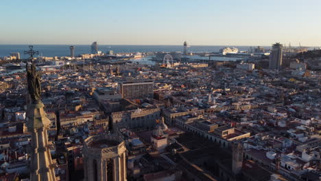 aerial dolly out revealing cathedral of barcelona in middle of the downtown