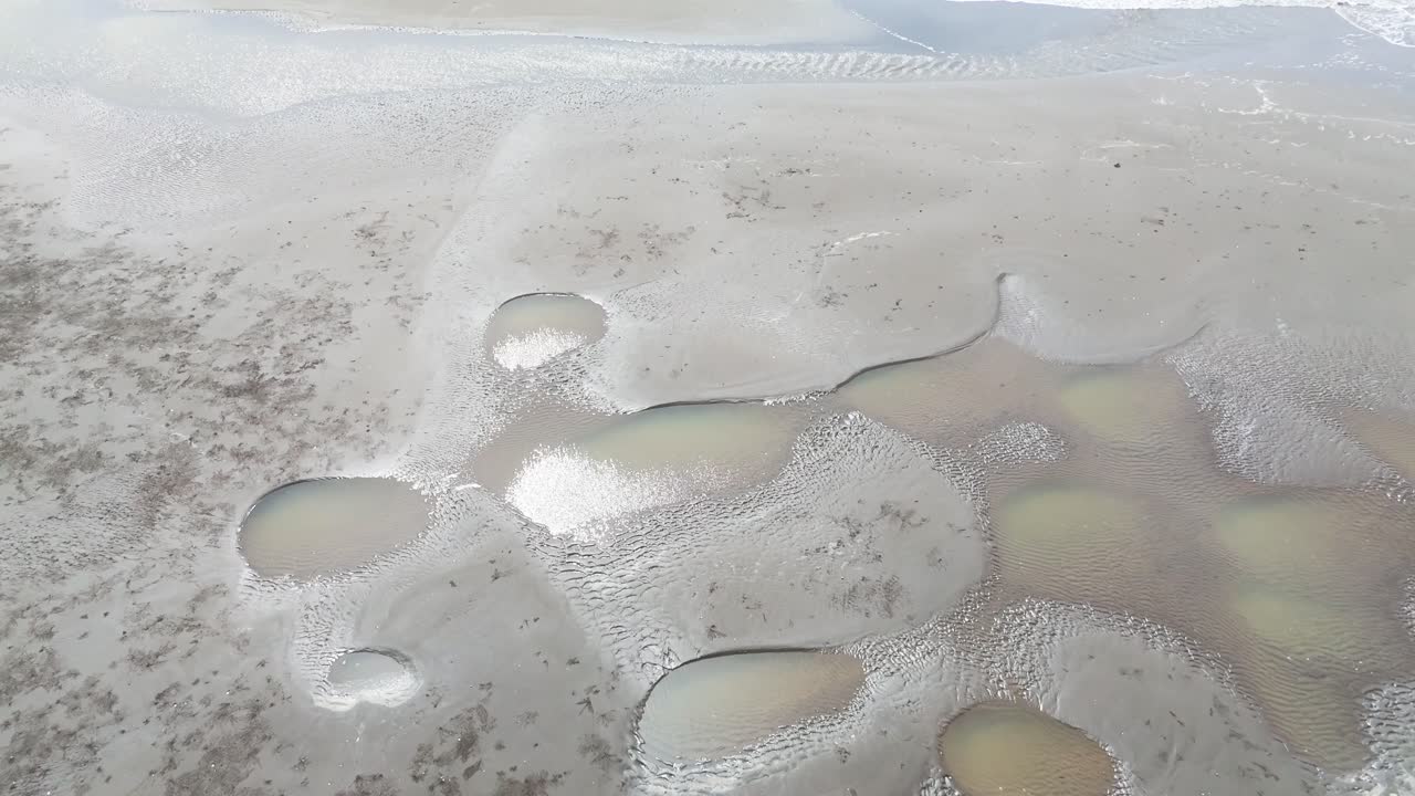 Aerial View Tilt Close of the Wind Farms at the Sea in Ben Tre.