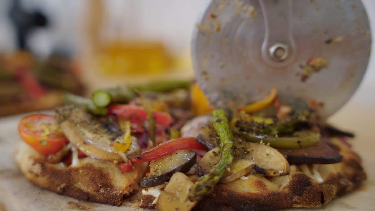 Close-up Of A Freshly Baked Vegetable Pizza Cut With A Pizza Cutter