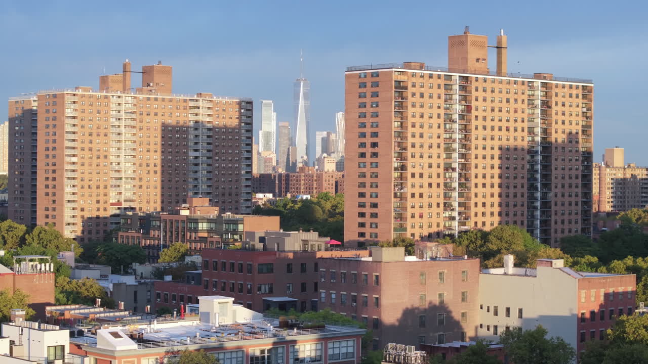 Aerial view of the World Trade Center between two apartment buildings in Brooklyn. Shot on a summer morning in New York City.