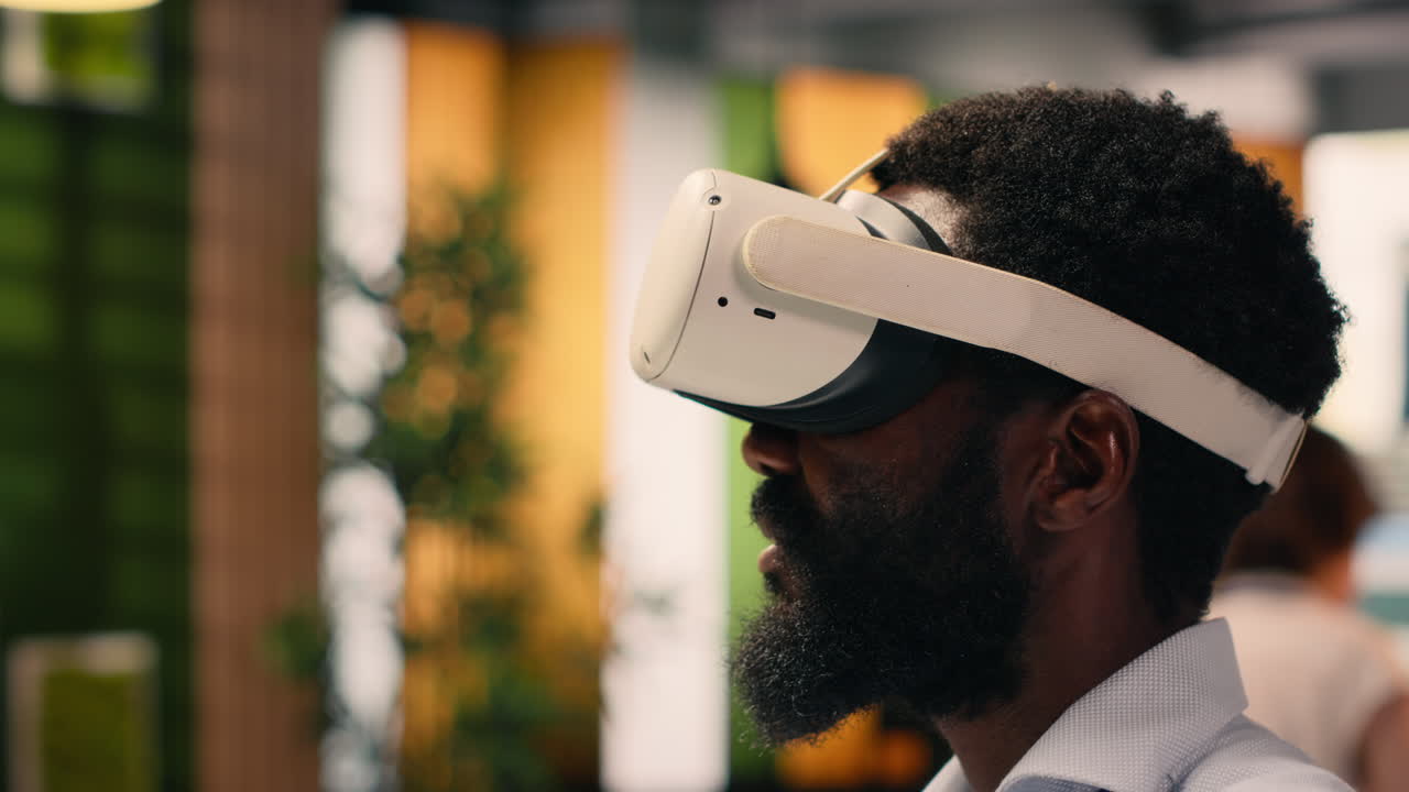 Black man, virtual reality simulation, VR headset, modern office