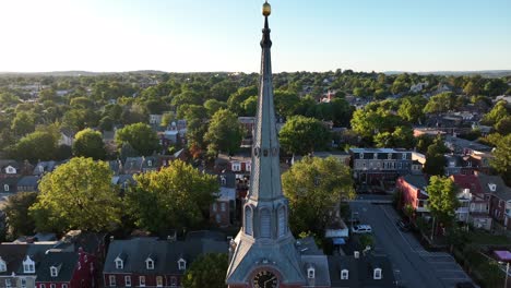 orthodox church with golden cross on top of steeple