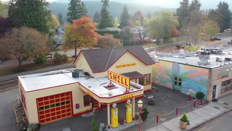 drone of small town retro gas station with christmas lights