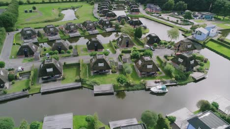 aerial overview of small dutch holiday park during summer with identical houses