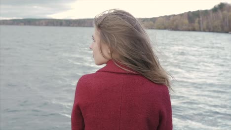 woman by the lake in autumn