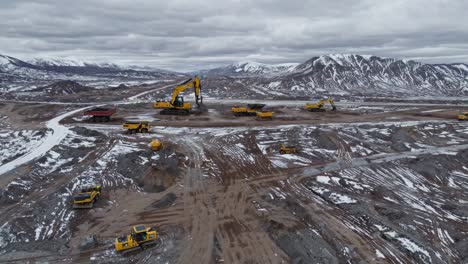 mining operation in a snowy mountainous terrain