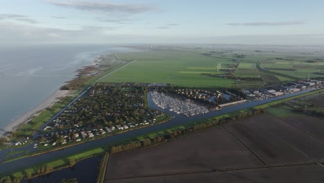 Aerial-view-of-small-harbour-with-sailboats-during-winter,-Workum,-Netherlands