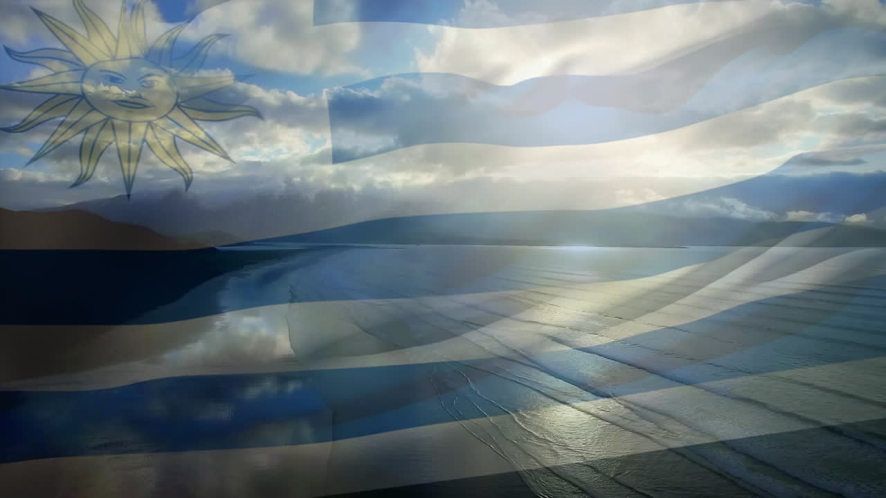 composición digital de la bandera uruguaya ondeando contra la vista aérea de la playa y el mar