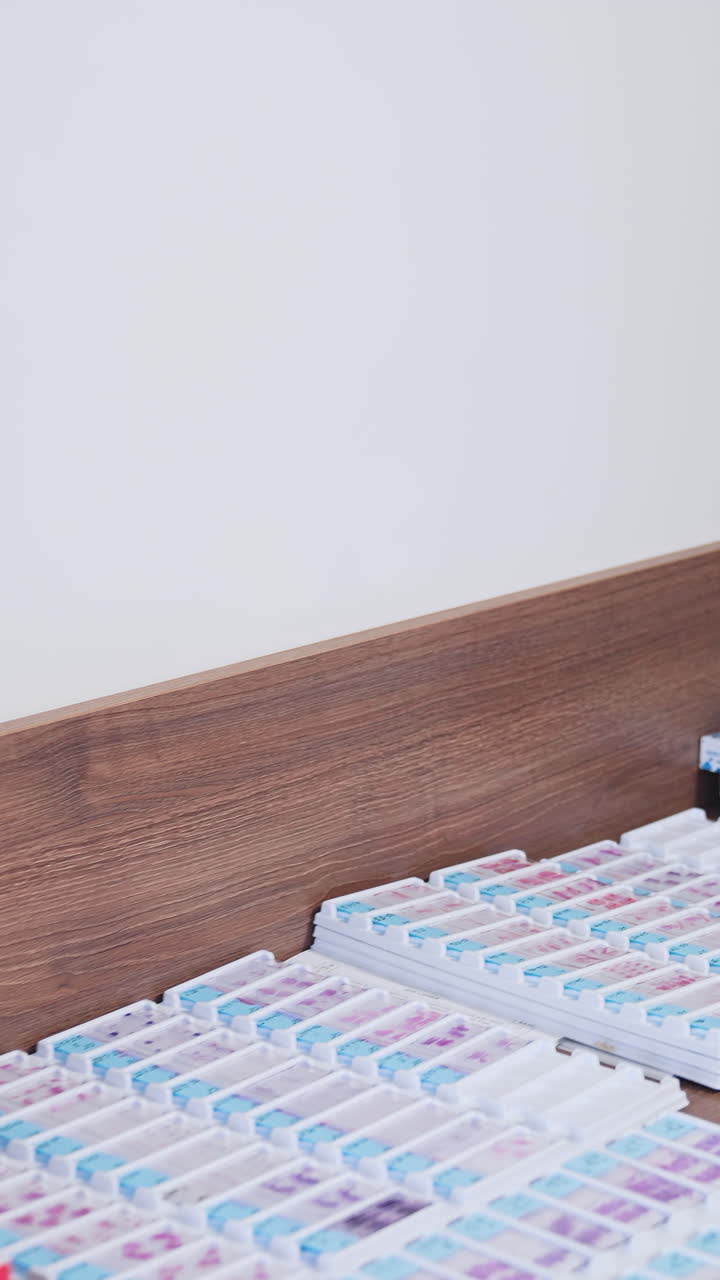 Modern microscope in the laboratory. View of microscope in medical and clinical laboratories. Vertical video