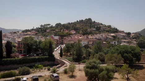 AERIAL:-Mediterranean-city-on-hills-with-traditonal-houses-in-mallorca