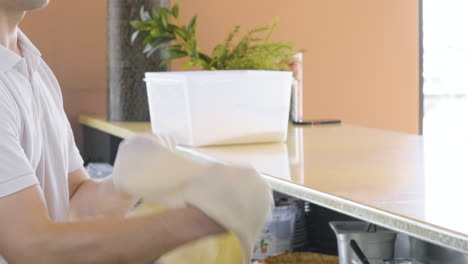 close up of a skillful chef tossing pizza dough in a restaurant