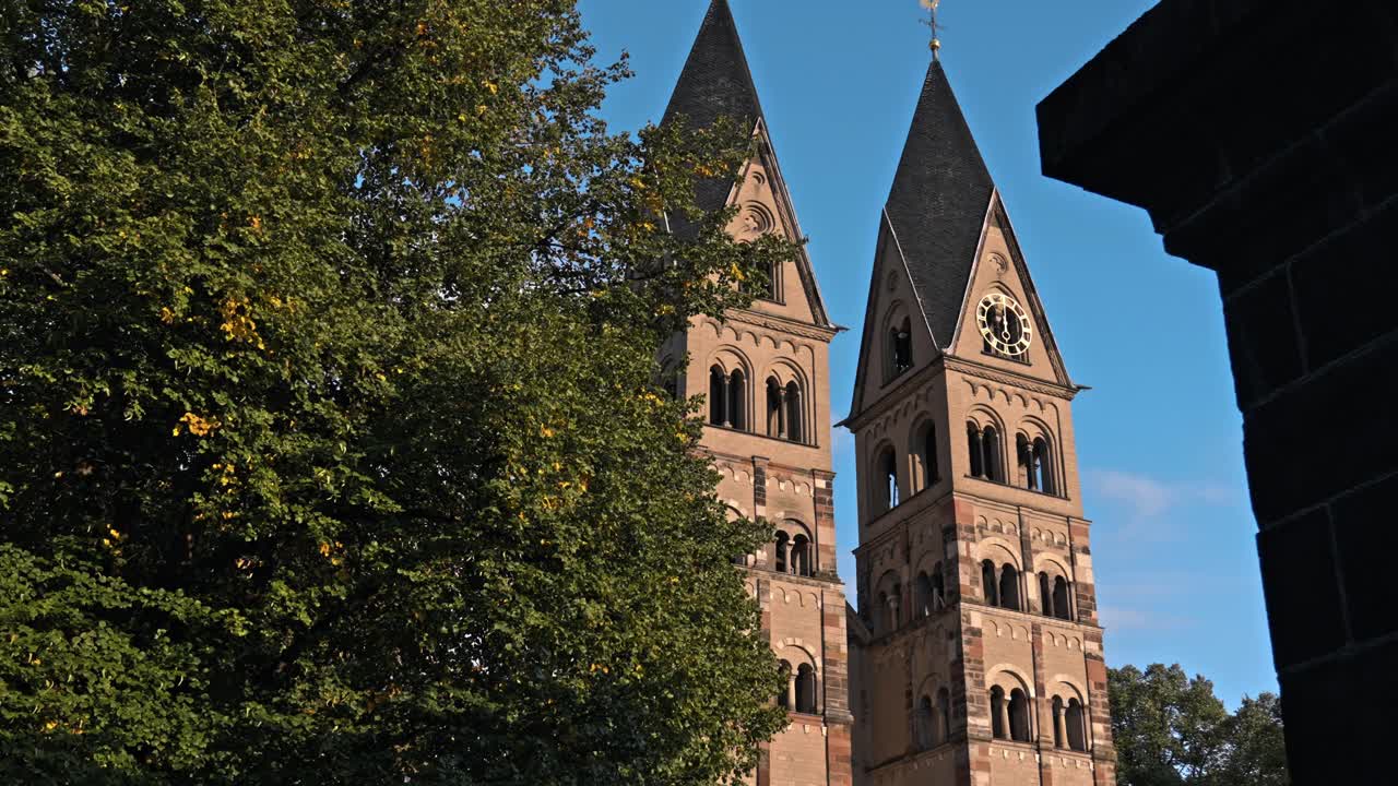 The historic Basilica of St. Castor, the oldest preserved church in Koblenz, Germany, prominently featuring its twin Romanesque western towers