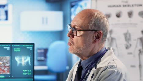 vertical video old man physician and patient meeting at checkup to review x ray scans