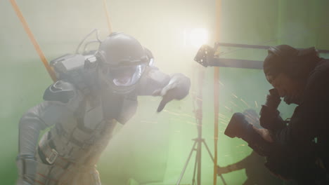 astronaut filming a scene on a green screen