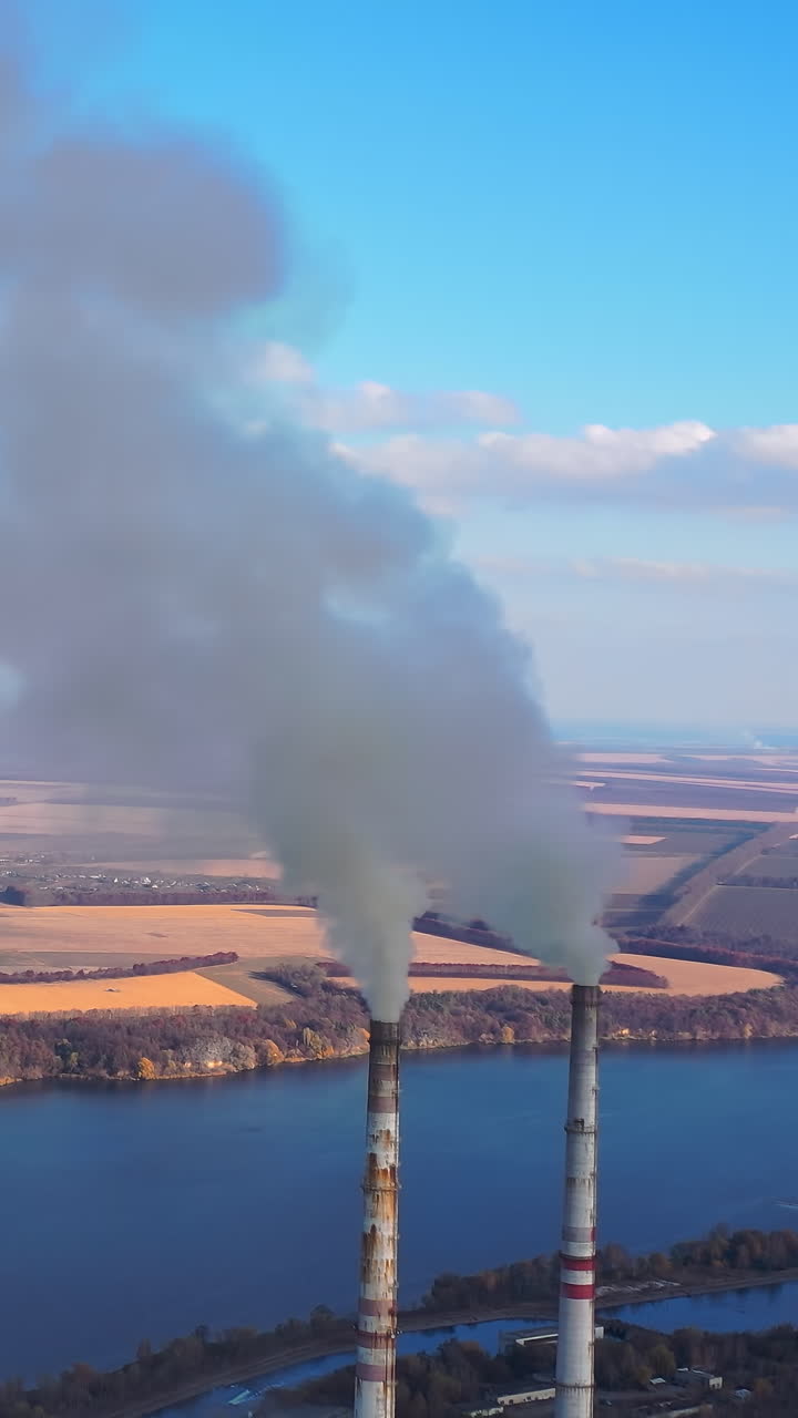 Power plant by the river. Large power plant near a big river