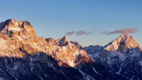 golden hour in the italian dolomites during winter season (drone footage)