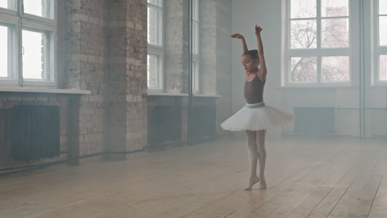 Little Ballerina Doing Pirouettes Dancing In Studio