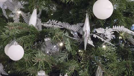 close up view of christmas tree with glitter tree branches decoration