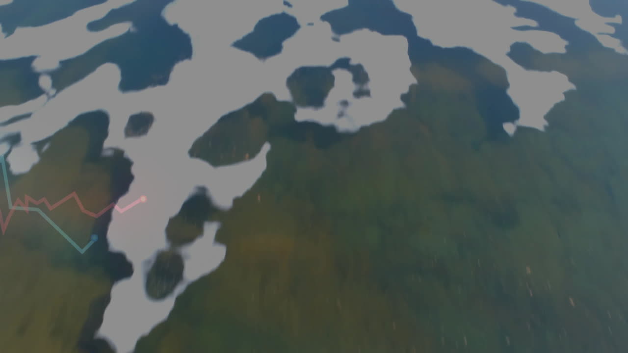 Red and teal line graphs overlaying aerial landscape with waterways winding through green foliage