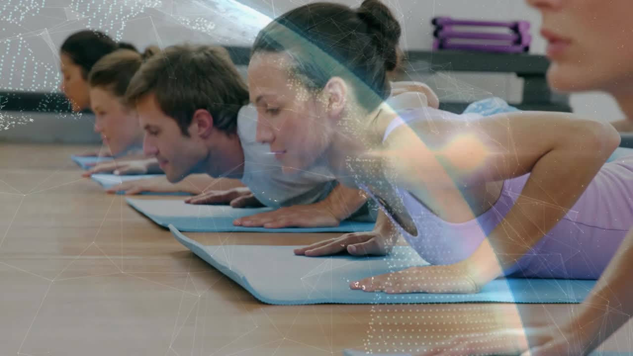 Fitness participants performing prone chest lifts on mats on cue, globe overlay showing gains
