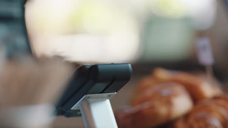 close up customer making contactless payment using smartphone mobile money transfer buying coffee in cafe enjoying service at restaurant