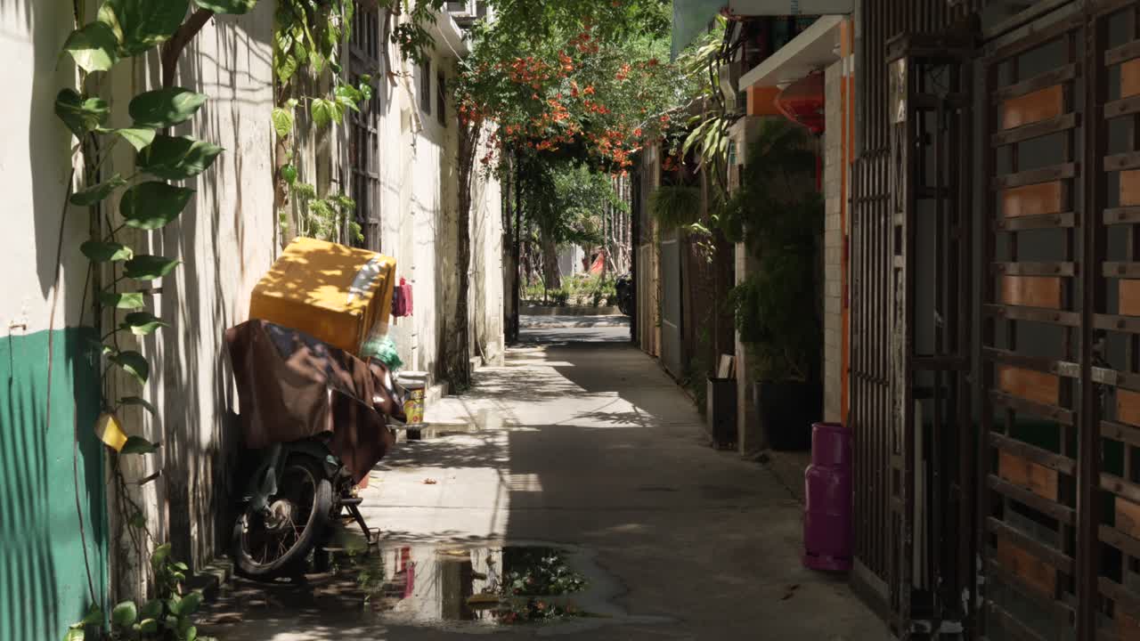 Narrow alleyway cozy street Hoi An old town city of Vietnam Southeast Asia
