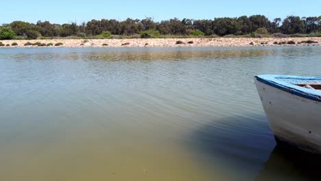 An-old-wooden-boat-at-a-pier-on-the-Segura-River-in-Spain