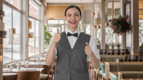 Happy-Indian-woman-waiter-showing-thumbs-up