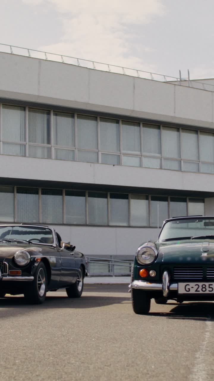 Vintage Cars in a City Parking Lot