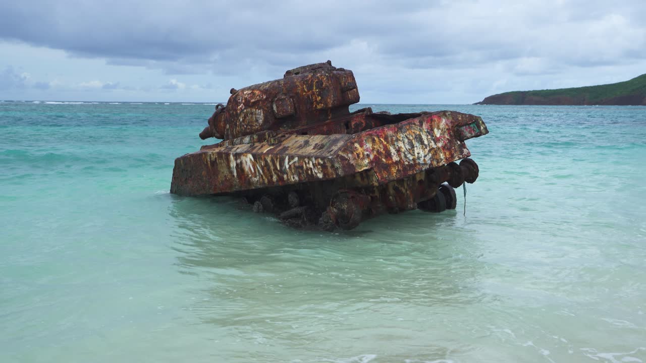 Close up view of rusted tank in Caribbean water off the coast of culebra island, flamenco beach Puerto Rico