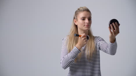 studio portrait of female make up artist shot in slow motion