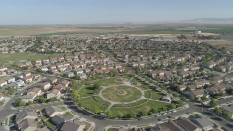 AERIAL---Tilt-Down-Drone-Shot-of-Suburban-Park-and-Neighborhood