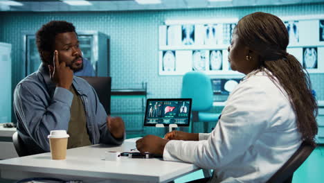 female specialist discussing health care concerns with a male patient