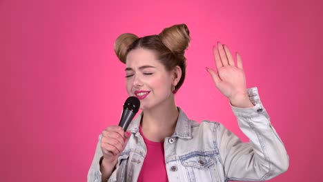 woman singing into a microphone