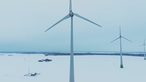 Aerial-view,-windmill-farm,-the-blades-rotate-and-produce-electricity-for-consumers