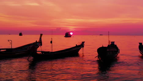 aerial shot of koh tao island, super sunset at sairee beach with many boats floating thailand