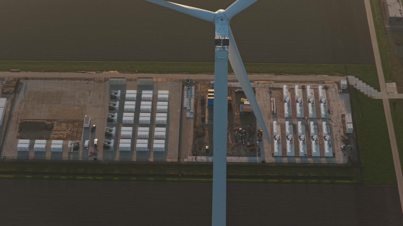Aerial view of wind turbine and battery energy storage system plant