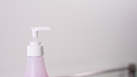a nurse sanitizing hands in a hospital