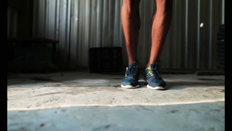 African-American-male-boxer-exercising-in-fitness-studio-4k