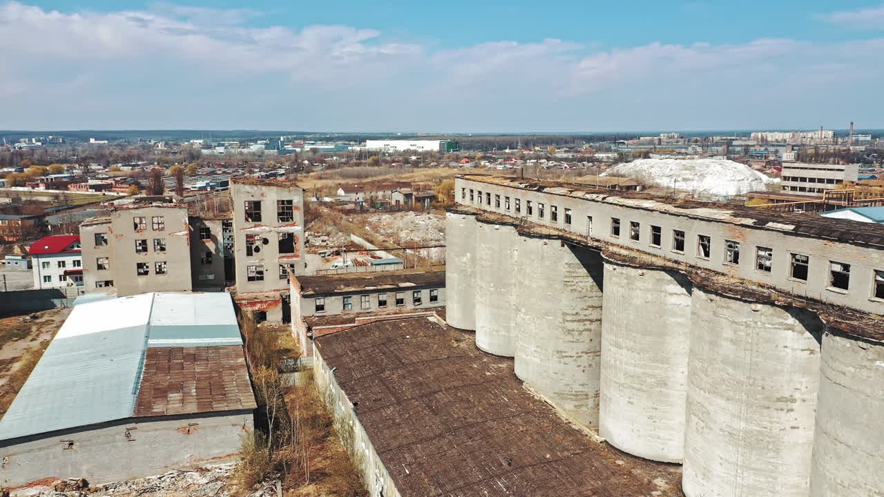 Flight over the destroyed factory. Old industrial building for demolition. Aerial view