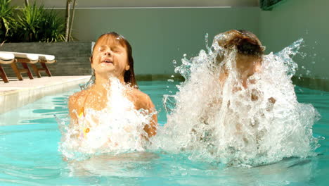 Siblings-having-fun-in-the-swimming-pool